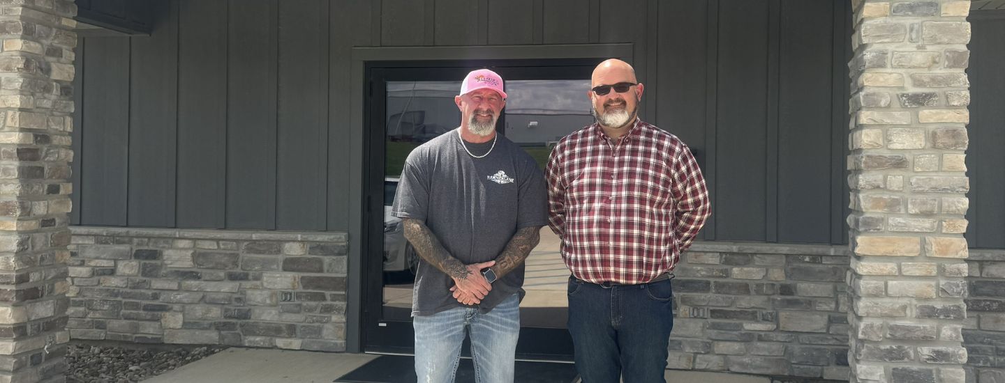 Steve and Sam Ditzfeld standing outside the office